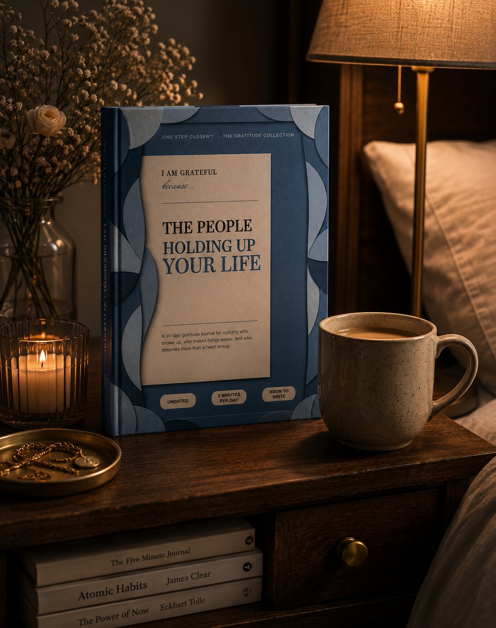 The People Holding Up Your Life journal on a nightstand